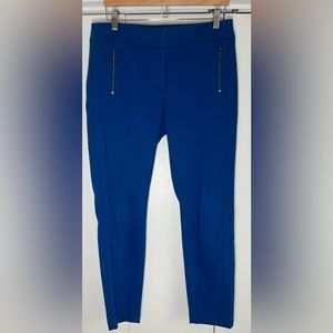 Royal blue skinny dress pants with flipper front pockets.